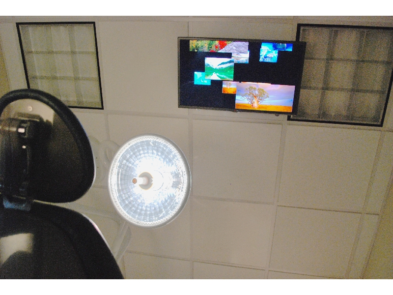 Televisions above every treatment chair
